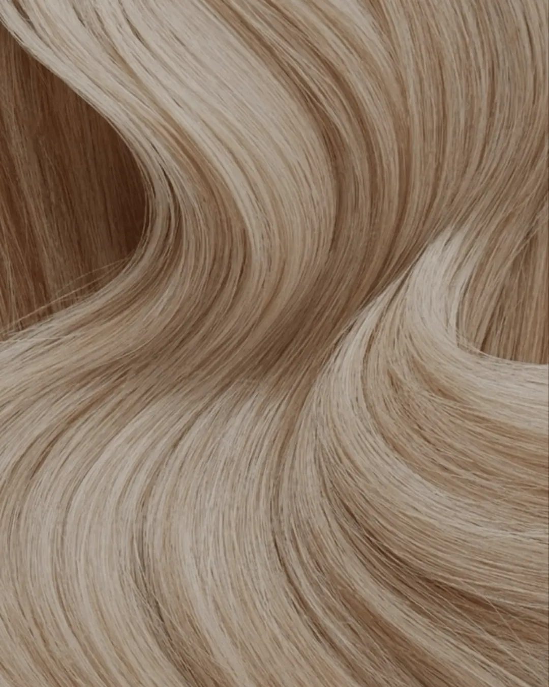 Sculptural waves in glossy blonde hair